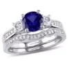 Budget 👏 1.31 ct. t.g.w. Created Blue and White Sapphire and 1/7 ct. t.w. Diamond Bridal Ring Set in 10K White Gold by Belk & Co. 🔥