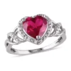 Wholesale ✔️ Lab Created 1/10 CT TW Diamond and Created Ruby Open Heart Crossover Ring in Sterling Silver by Belk & Co. ⭐